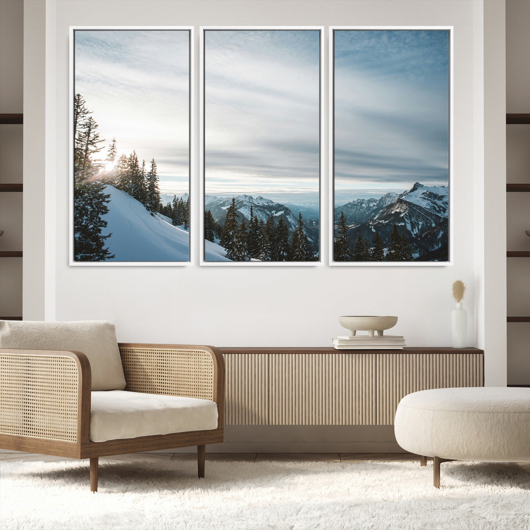A breathtaking view of snow-covered mountains with evergreen trees and soft sunlight peeking through, creating a serene and peaceful winter scene.