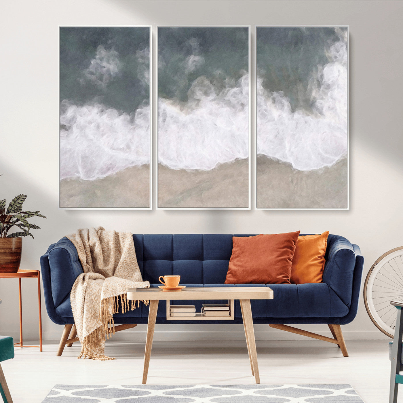 Wall art canvas print featuring foamy ocean waves softly rolling onto a sandy shore with a dreamy, painterly texture.