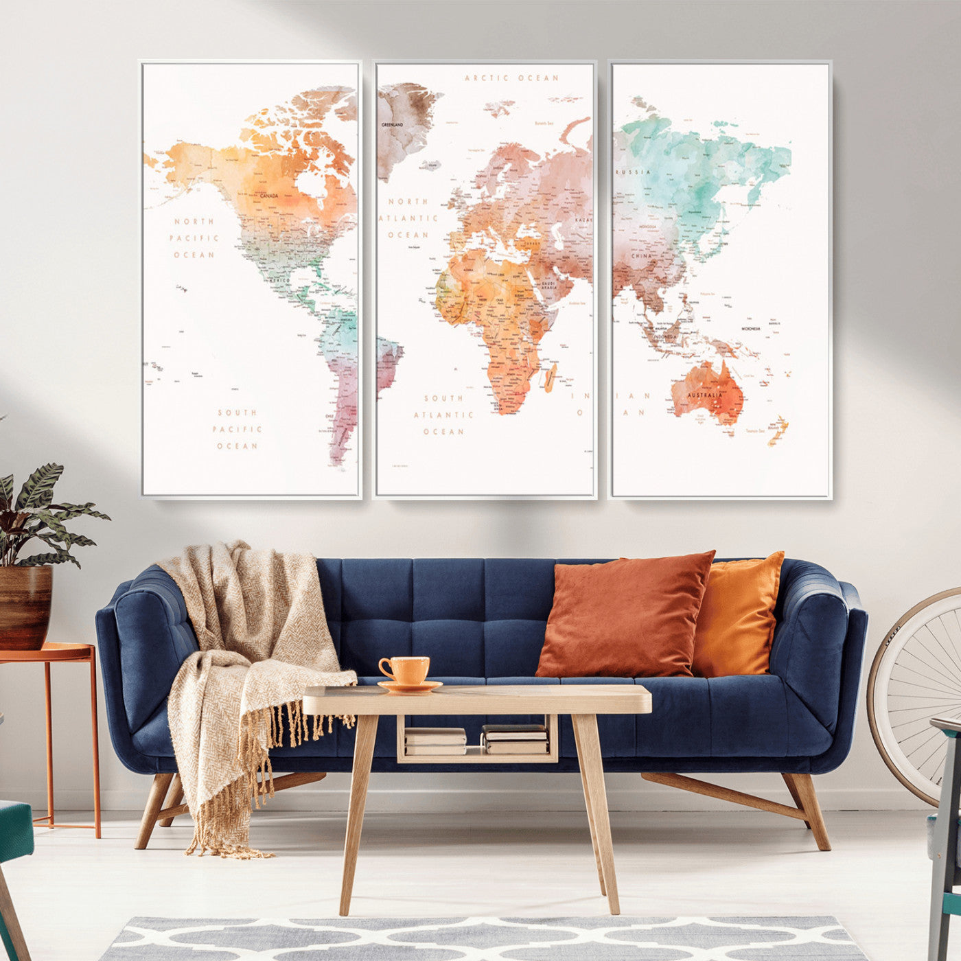 Watercolor world map featuring soft pastel hues in orange, green, blue, and purple on a light background, printed on canvas for vibrant and artistic wall decor.