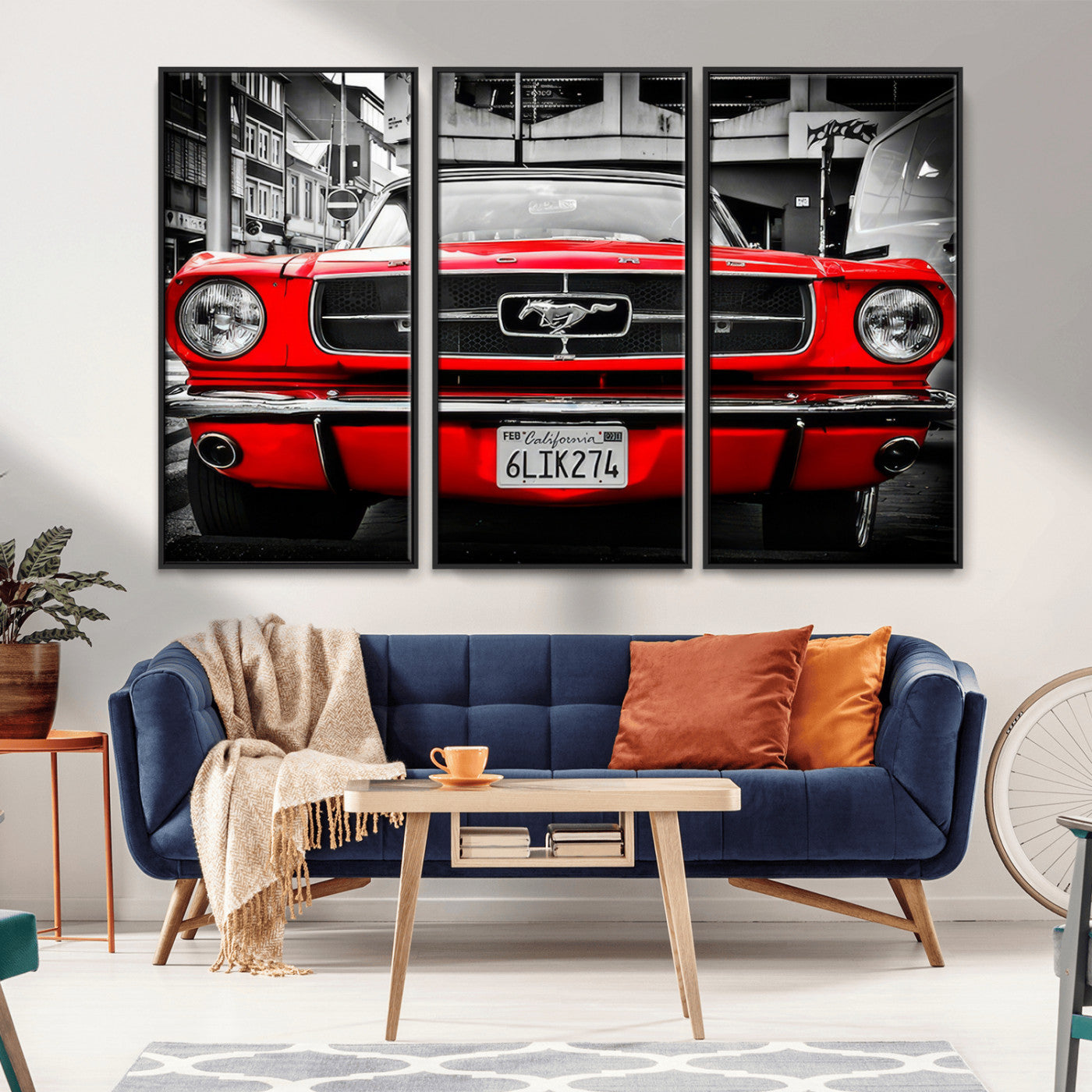 Front view of a bold red 1960s Ford Mustang parked in an urban environment, captured in dramatic contrast with a black-and-white city backdrop, emphasizing its timeless American muscle car identity.