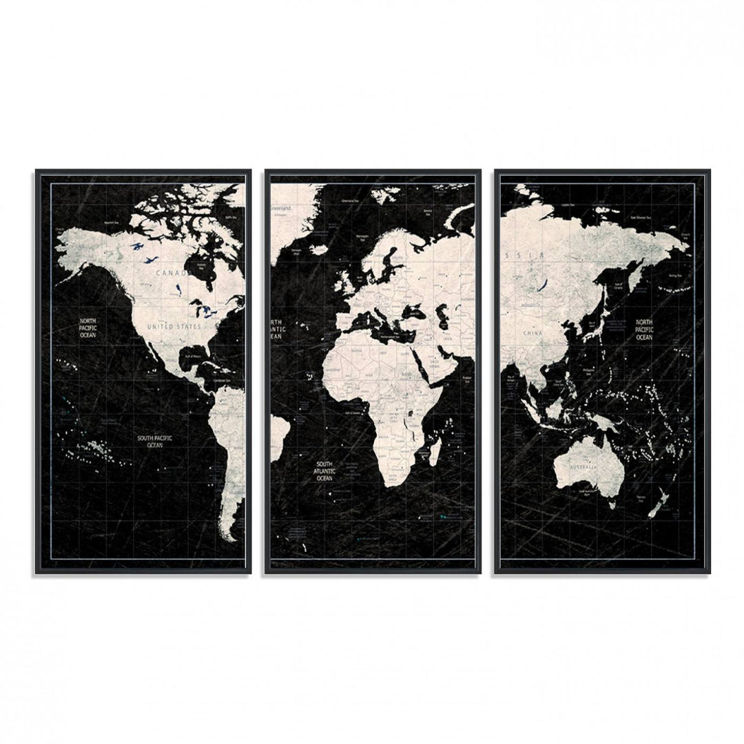 A bold global style framed black and white world map canvas print, presented in three panels, perfect for modern home or office decor.