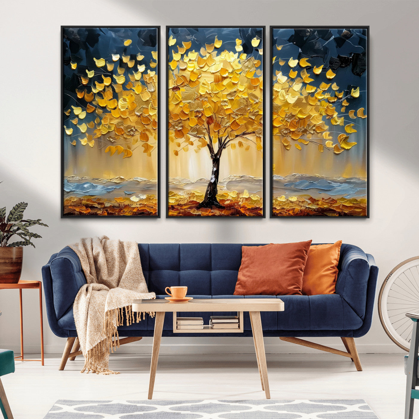 Canvas of a golden autumn tree with textured brushstrokes and moody blue skies, perfect for dramatic and vibrant home decor.