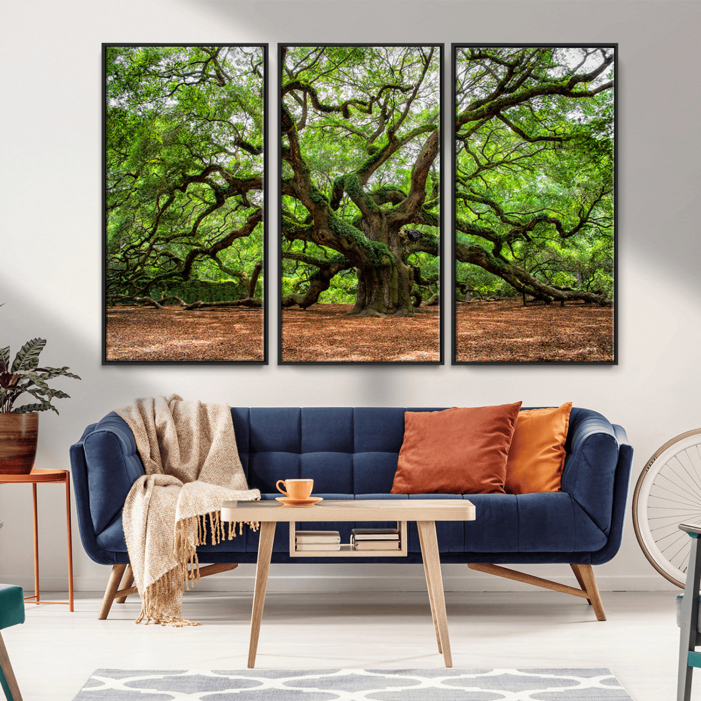 A majestic, ancient tree with expansive, twisting branches spreading wide under a dense, vibrant green canopy in a serene forest clearing.