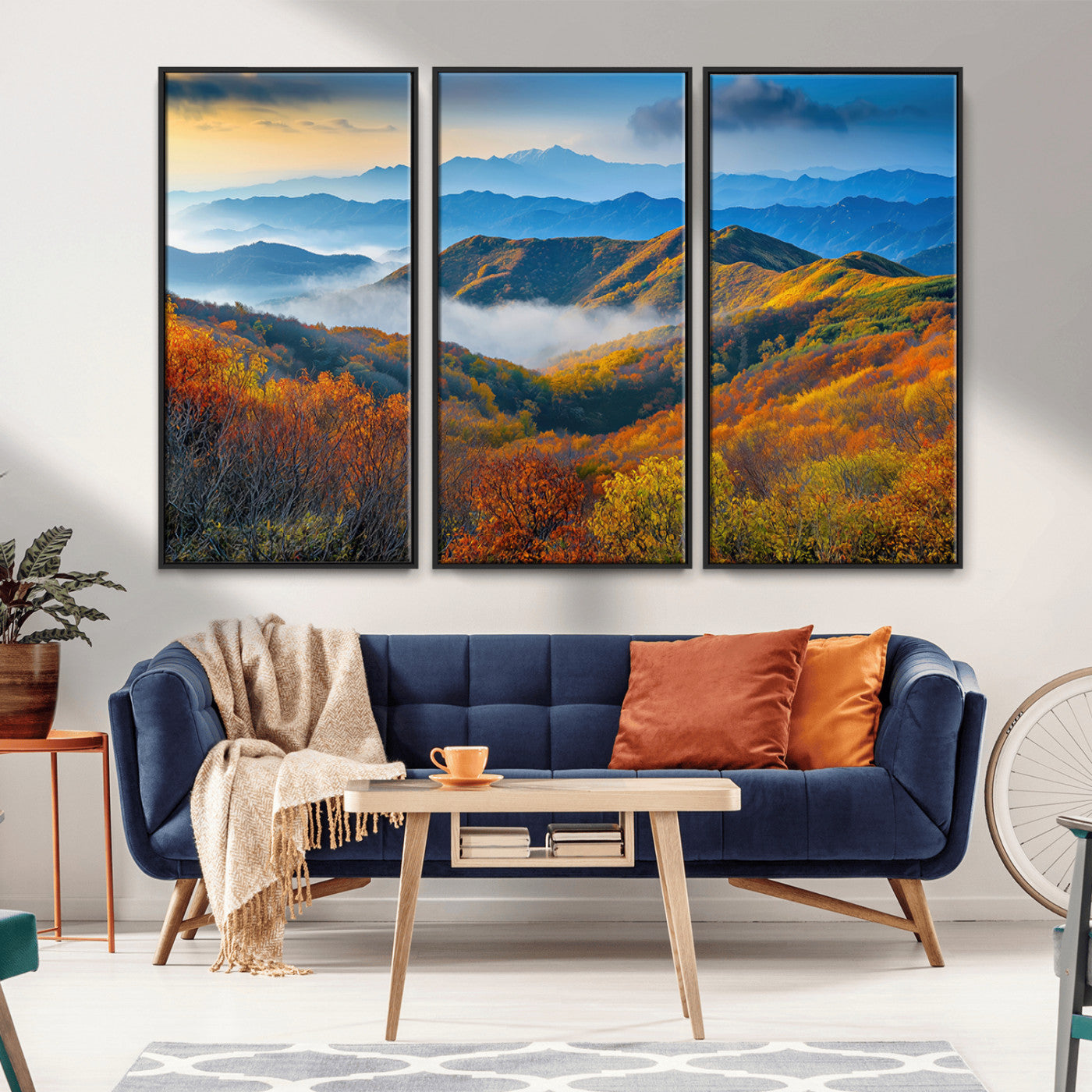 Vibrant canvas of autumn mountains with colorful trees, layered blue ridges, and soft morning fog, ideal for bright nature-themed decor.