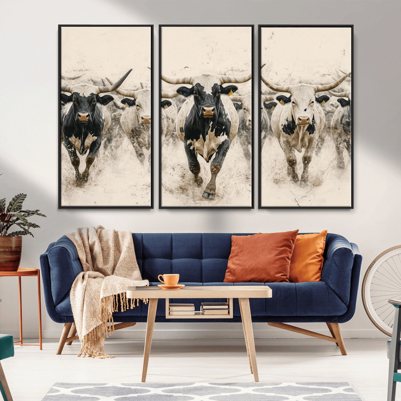 Canvas artwork of Texas Longhorn bulls walking in a dusty herd, ideal for rustic Western or country-style interior decor.