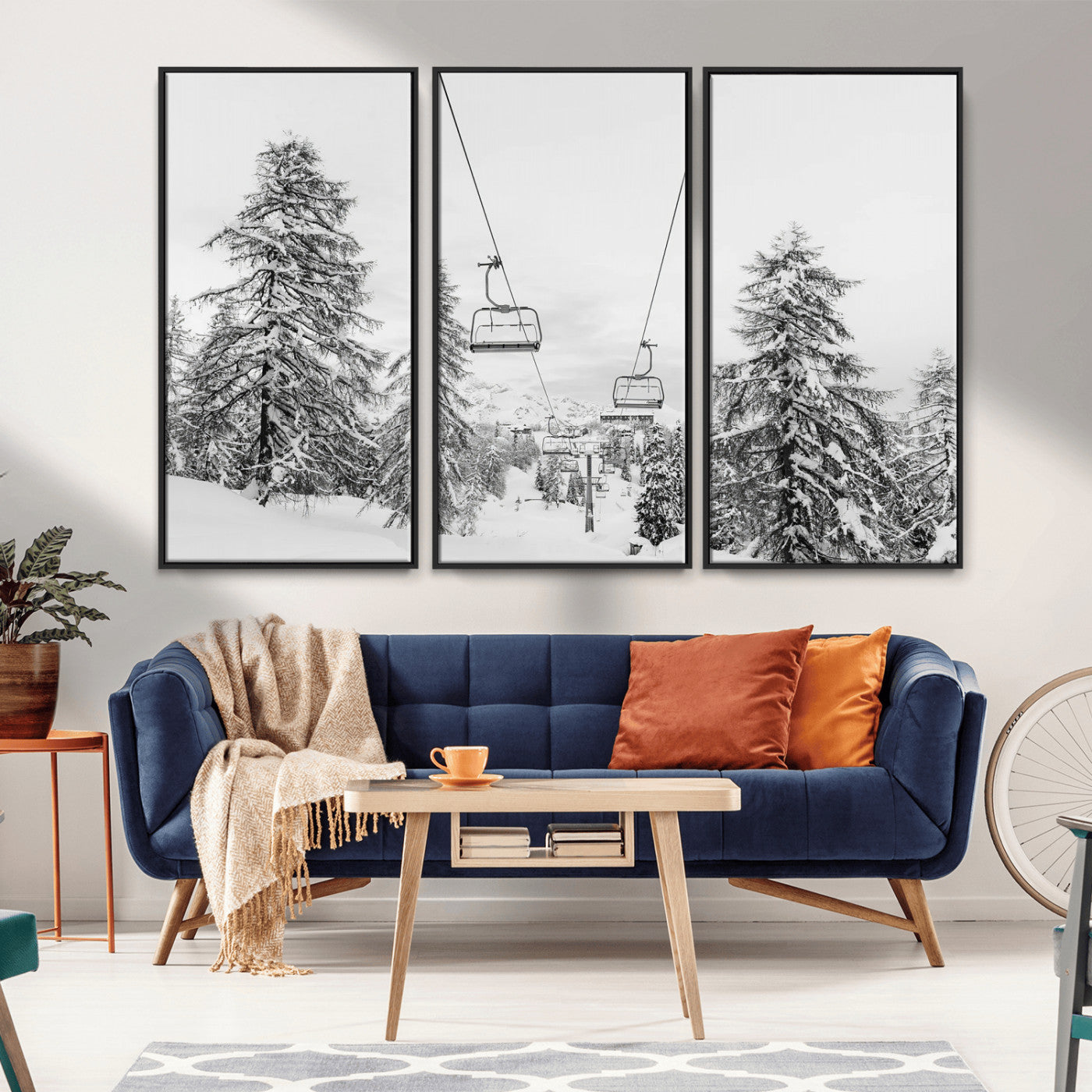 Black and white image of a ski lift amidst snow-covered pine trees, ideal for winter mountain or cabin-themed decor.