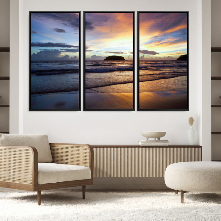 A tropical beach at sunset with waves gently washing ashore, reflecting golden and purple hues in the sky, creating a tranquil coastal scene.