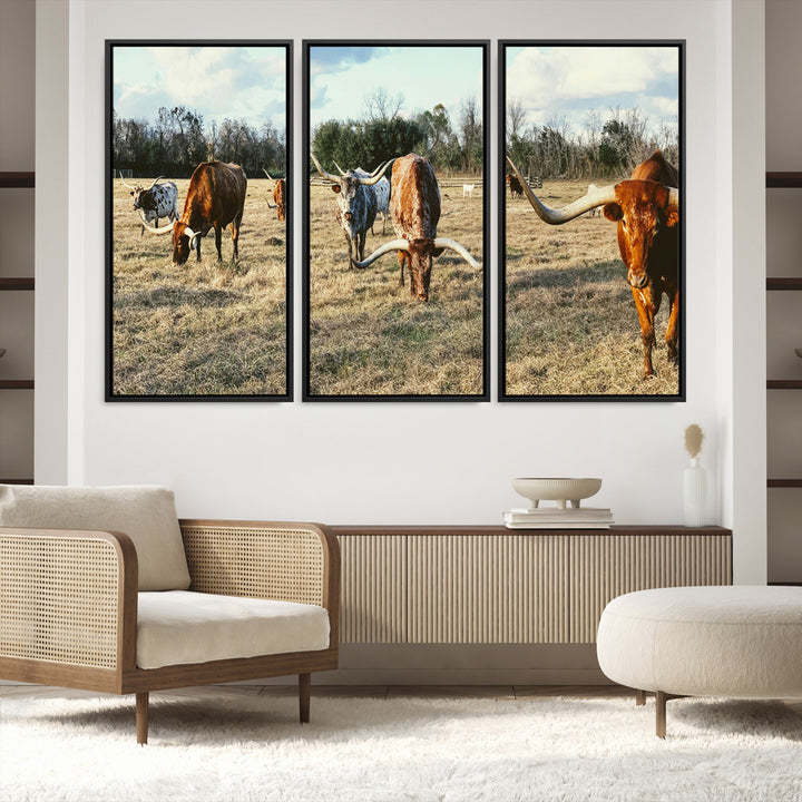 A herd of Texas Longhorn cattle grazing in an open field under a partly cloudy sky, capturing a rustic and Western ranch aesthetic.