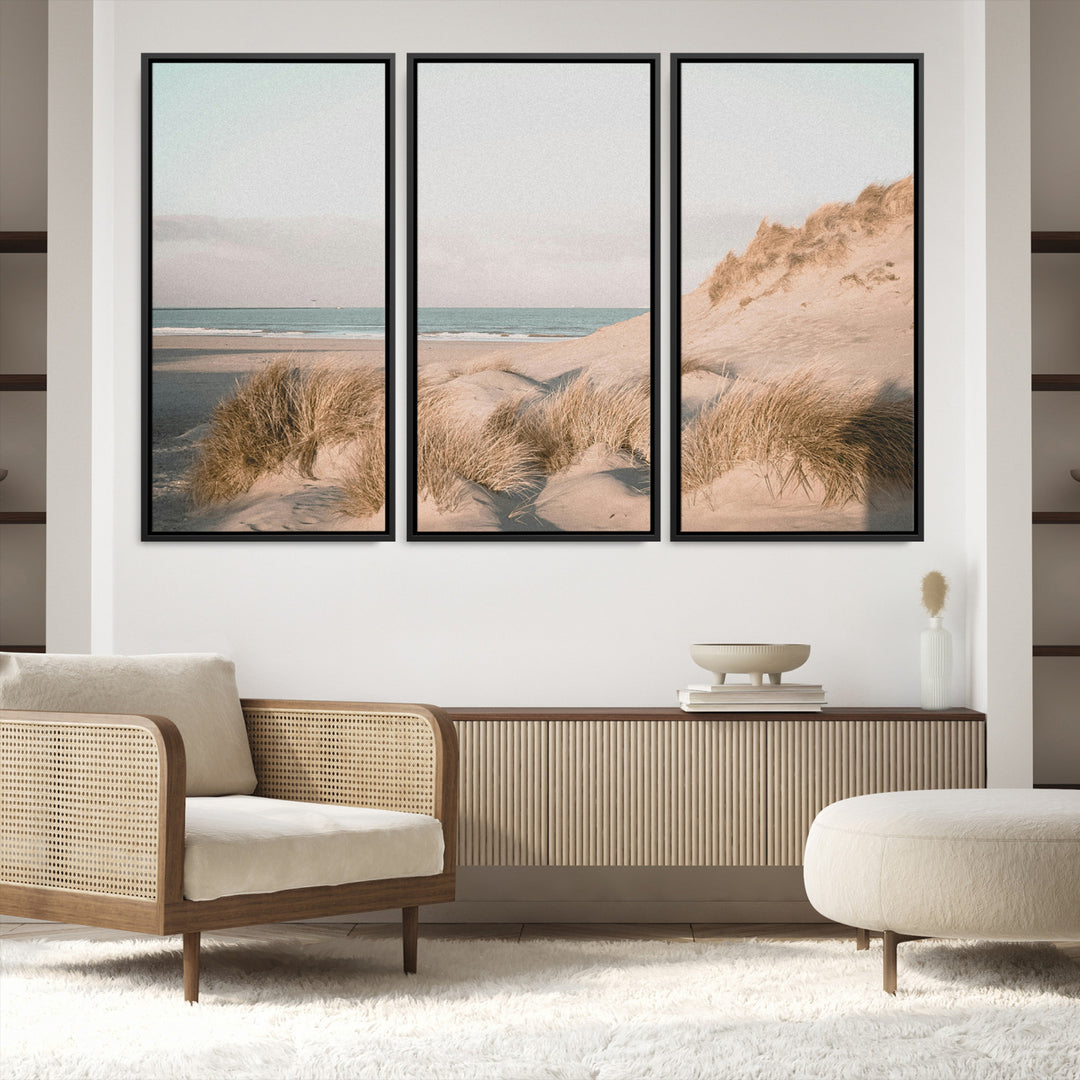 Soft pastel-toned beach scene with sand dunes, windswept grasses, and a calm ocean horizon, creating a serene coastal atmosphere.