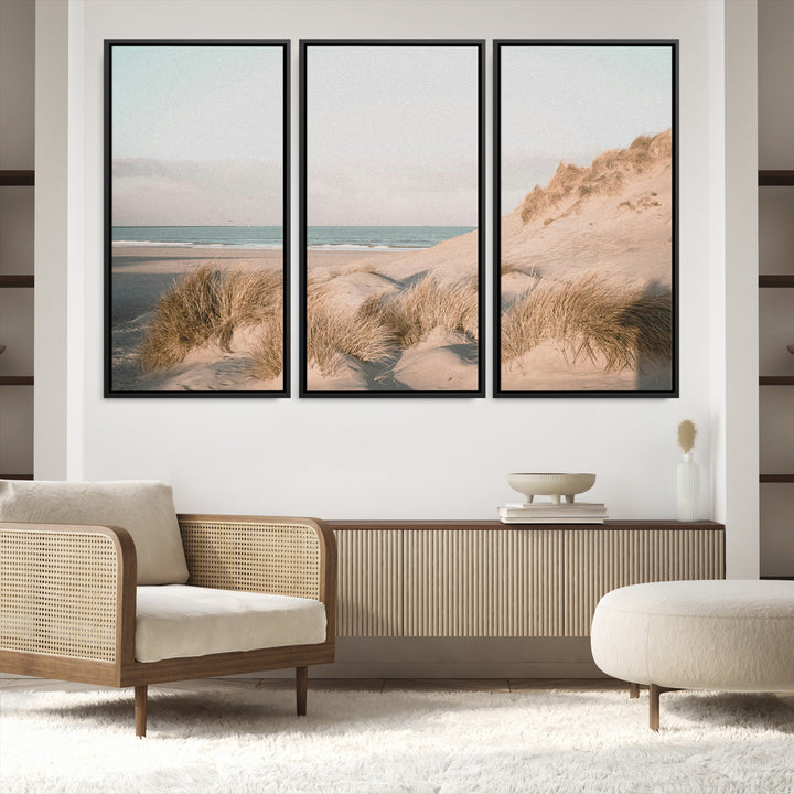 Soft pastel-toned beach scene with sand dunes, windswept grasses, and a calm ocean horizon, creating a serene coastal atmosphere.