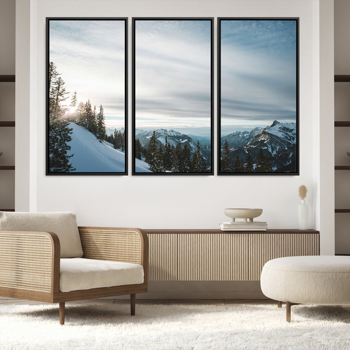 A breathtaking view of snow-covered mountains with evergreen trees and soft sunlight peeking through, creating a serene and peaceful winter scene.