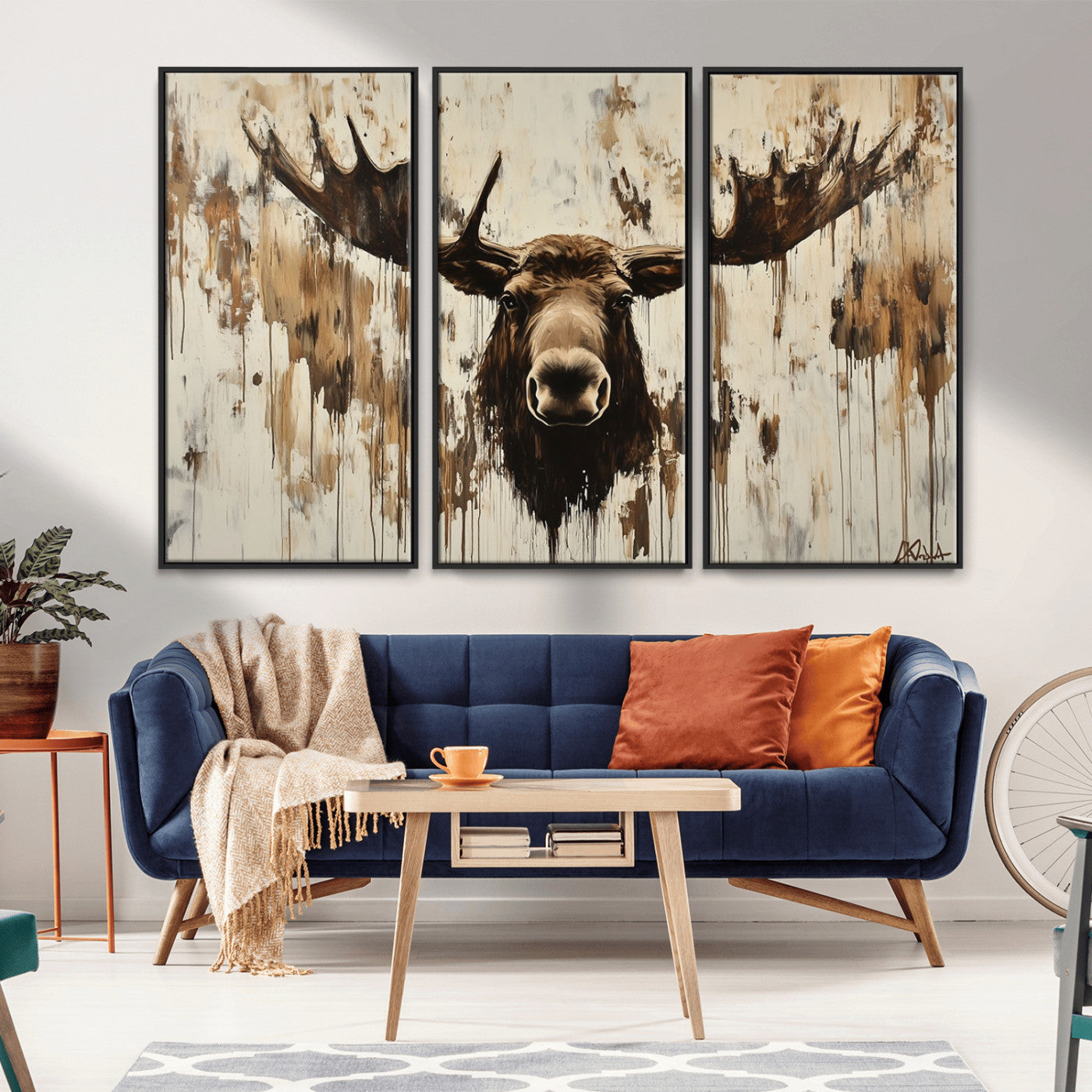 Expressive painting of a moose head with wide antlers in dark brown and beige tones, featuring paint drips and splatters on a light textured background, creating a striking rustic wall art canvas.