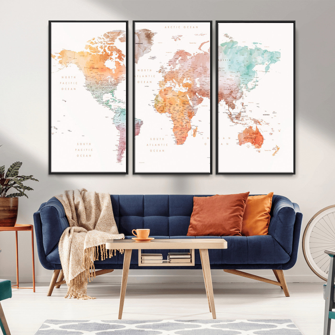 Watercolor world map featuring soft pastel hues in orange, green, blue, and purple on a light background, printed on canvas for vibrant and artistic wall decor.