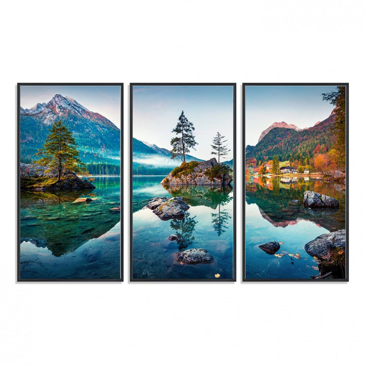 The 3-panel wall art showcases a serene mountain lake with rocky islands and trees, creating an ideal focal point for dining rooms or offices.