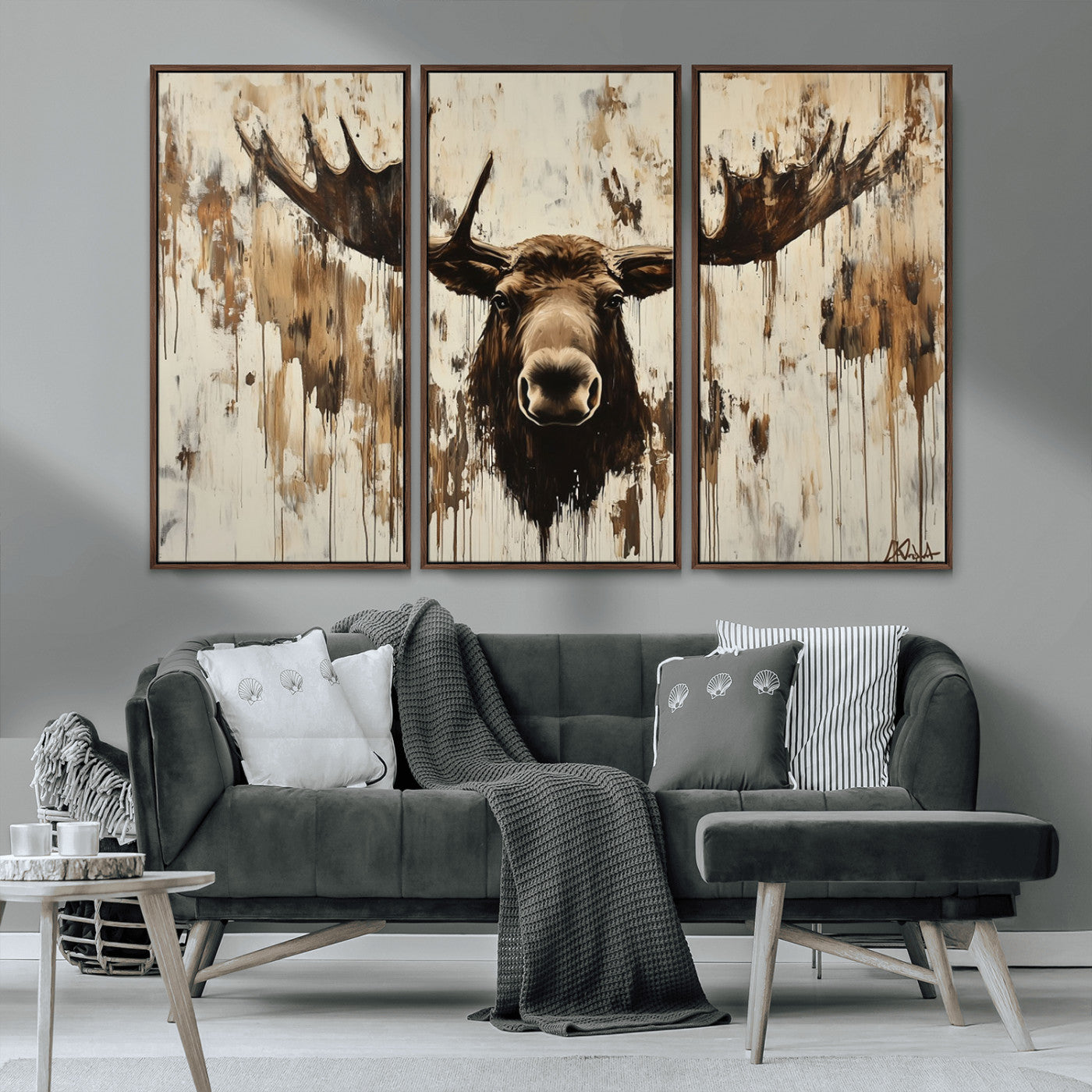 Expressive painting of a moose head with wide antlers in dark brown and beige tones, featuring paint drips and splatters on a light textured background, creating a striking rustic wall art canvas.