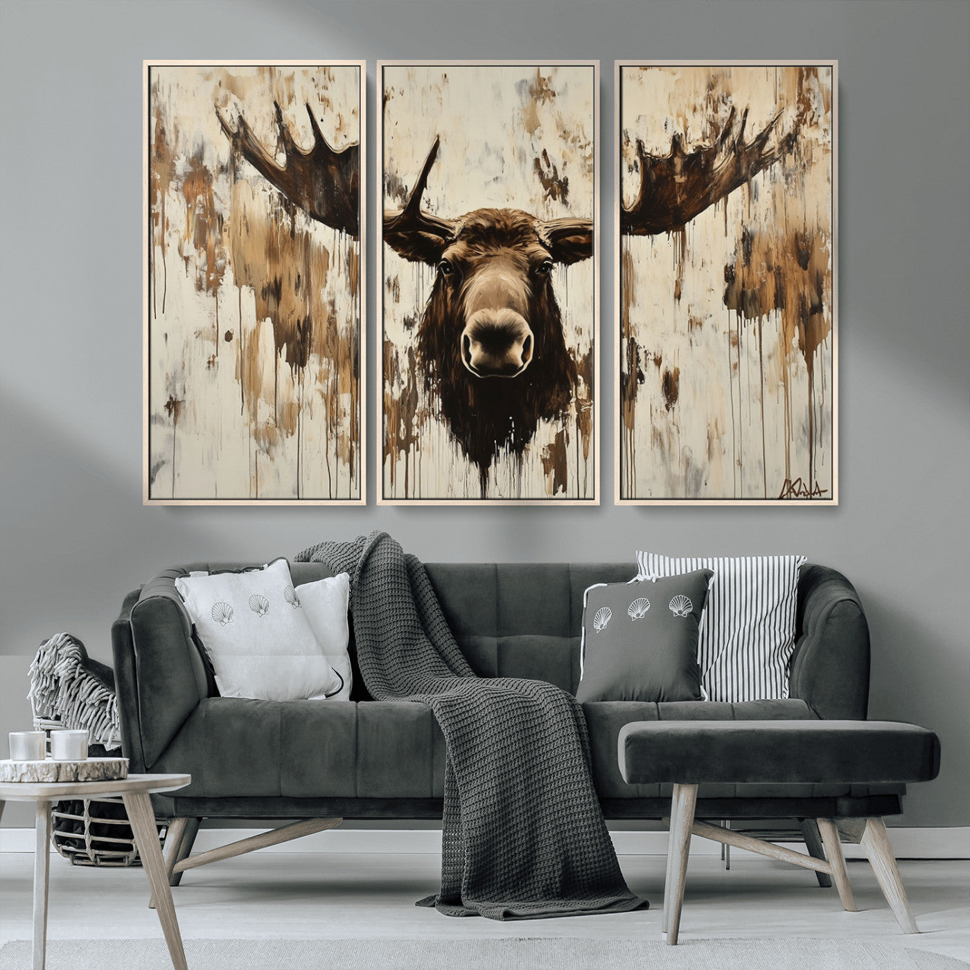 Expressive painting of a moose head with wide antlers in dark brown and beige tones, featuring paint drips and splatters on a light textured background, creating a striking rustic wall art canvas.