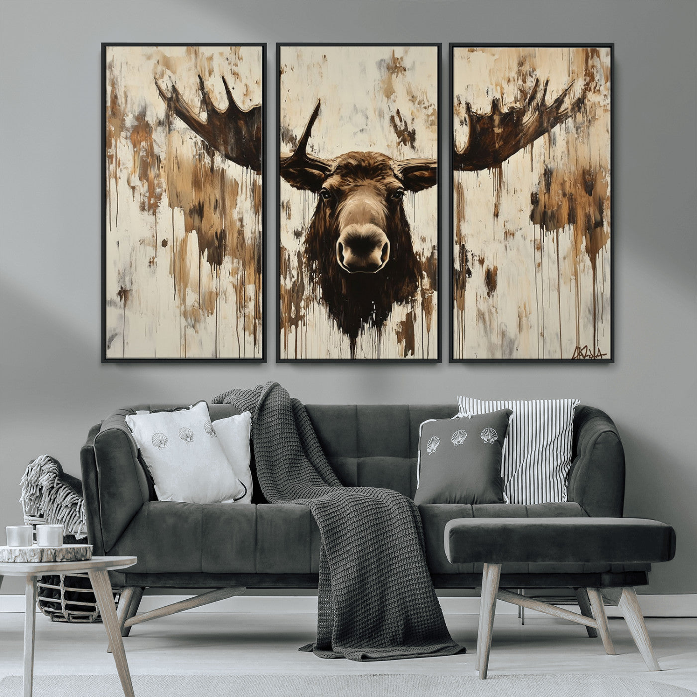 Expressive painting of a moose head with wide antlers in dark brown and beige tones, featuring paint drips and splatters on a light textured background, creating a striking rustic wall art canvas.