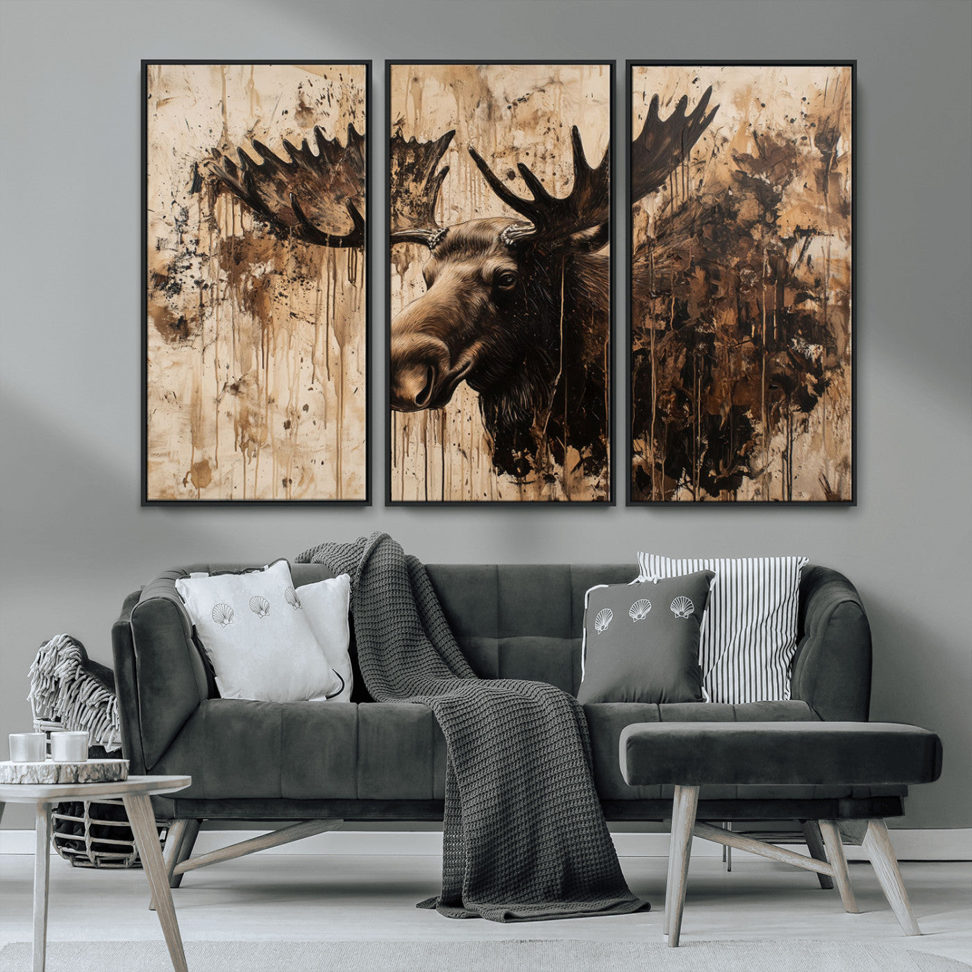 Artistic painting of a moose head with large antlers in shades of brown and black, with paint splatters and drips on a beige textured background, creating a rustic and expressive wall art canvas.