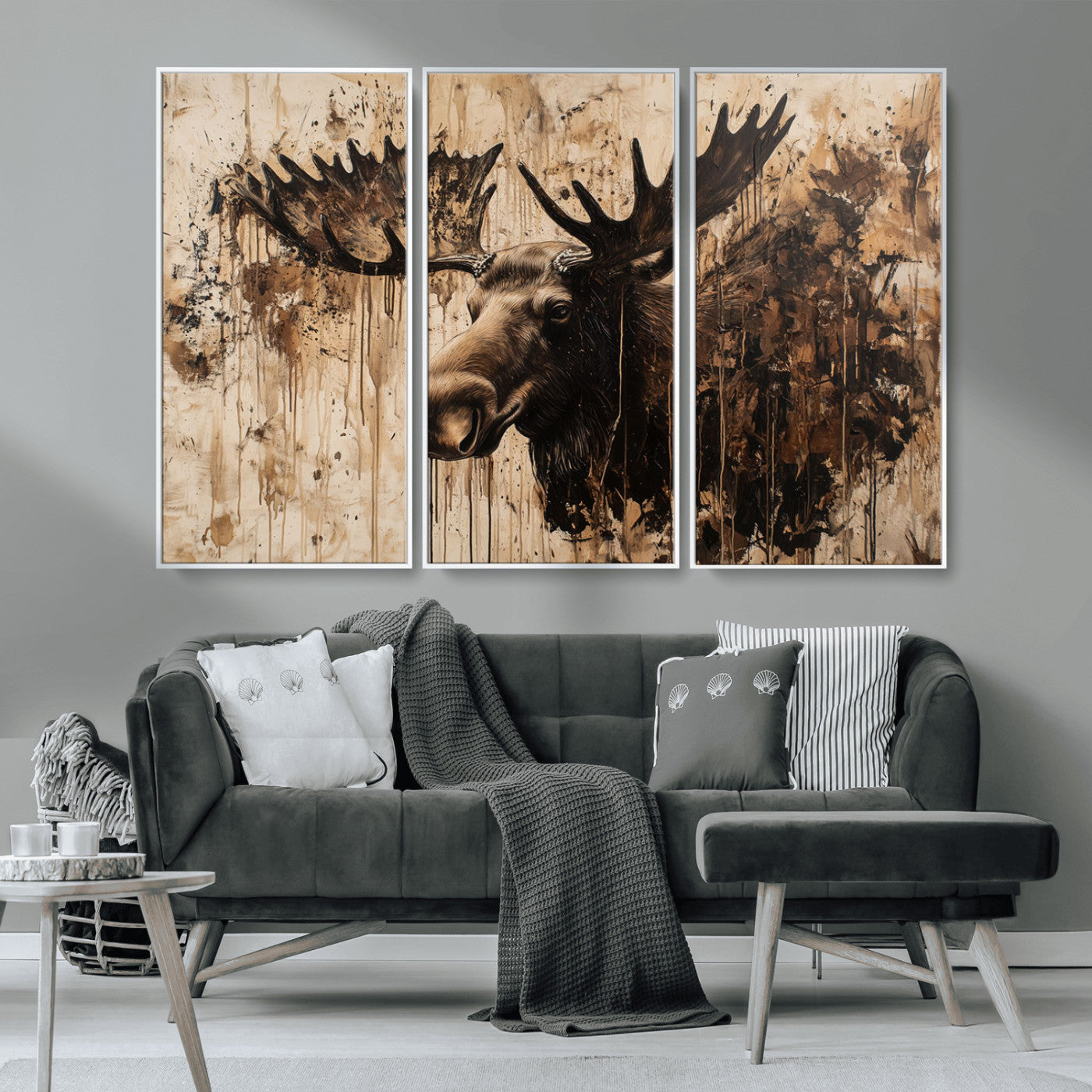 Artistic painting of a moose head with large antlers in shades of brown and black, with paint splatters and drips on a beige textured background, creating a rustic and expressive wall art canvas.