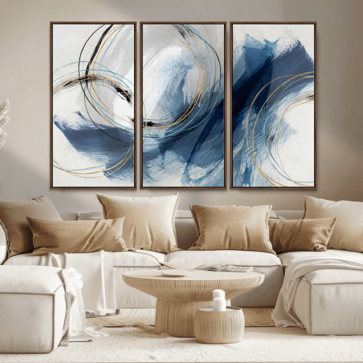 Abstract wall art featuring dynamic brush strokes in shades of blue and gray, overlaid with delicate circular line patterns in gold, black, and light blue on a white background.