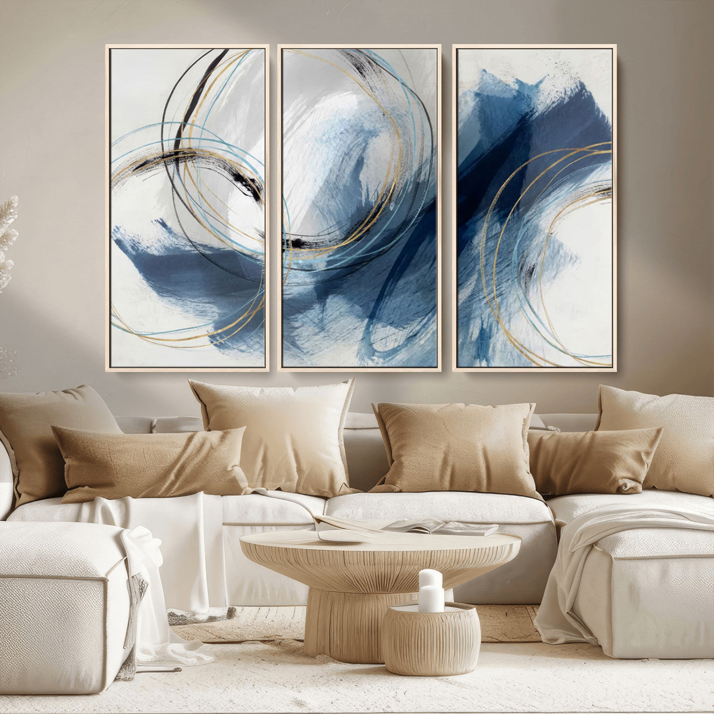 Abstract wall art featuring dynamic brush strokes in shades of blue and gray, overlaid with delicate circular line patterns in gold, black, and light blue on a white background.
