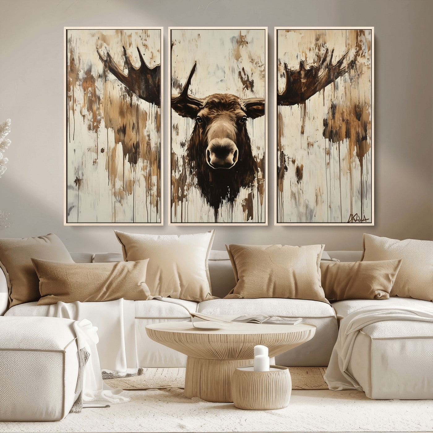 Expressive painting of a moose head with wide antlers in dark brown and beige tones, featuring paint drips and splatters on a light textured background, creating a striking rustic wall art canvas.