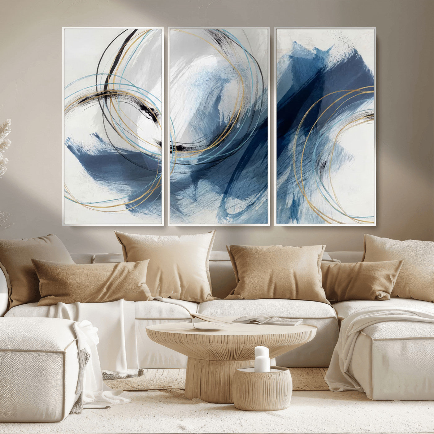 Abstract wall art featuring dynamic brush strokes in shades of blue and gray, overlaid with delicate circular line patterns in gold, black, and light blue on a white background.