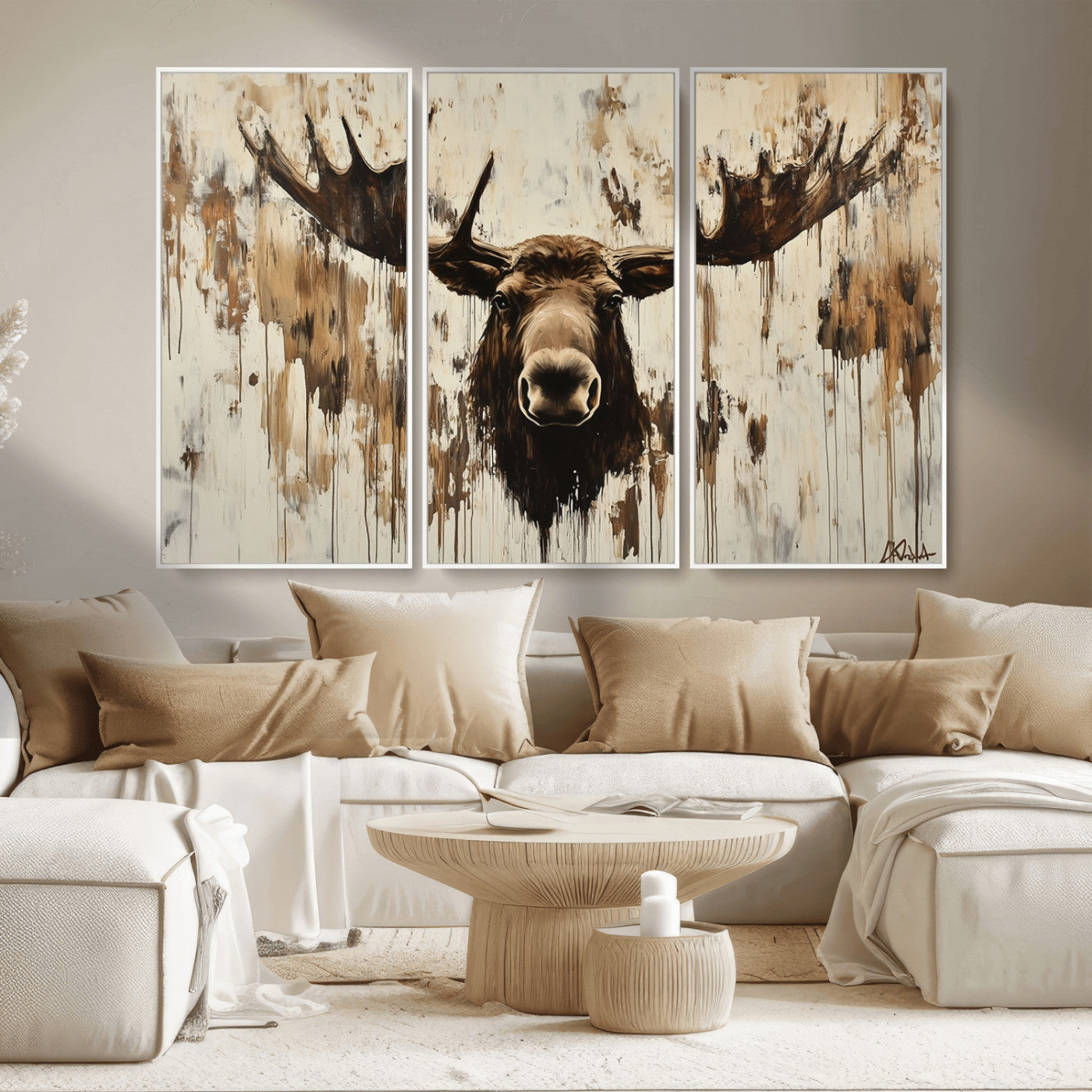 Expressive painting of a moose head with wide antlers in dark brown and beige tones, featuring paint drips and splatters on a light textured background, creating a striking rustic wall art canvas.