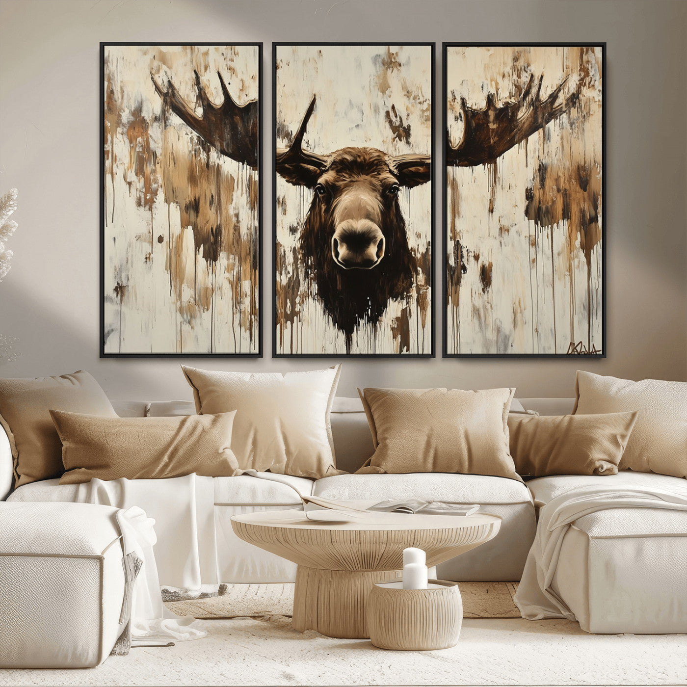 Expressive painting of a moose head with wide antlers in dark brown and beige tones, featuring paint drips and splatters on a light textured background, creating a striking rustic wall art canvas.