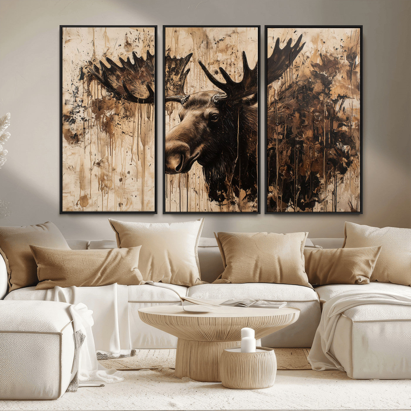 Artistic painting of a moose head with large antlers in shades of brown and black, with paint splatters and drips on a beige textured background, creating a rustic and expressive wall art canvas.