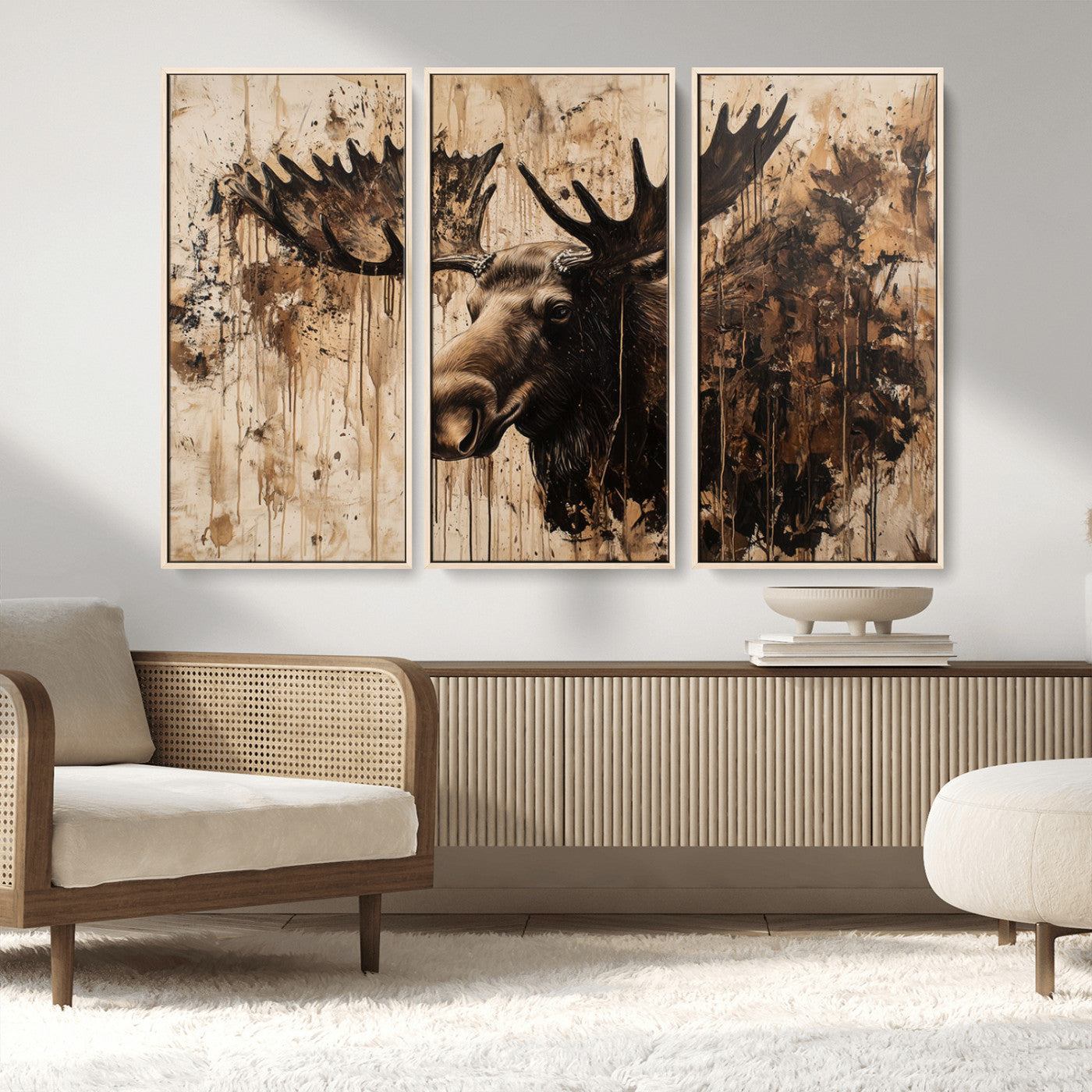 Artistic painting of a moose head with large antlers in shades of brown and black, with paint splatters and drips on a beige textured background, creating a rustic and expressive wall art canvas.