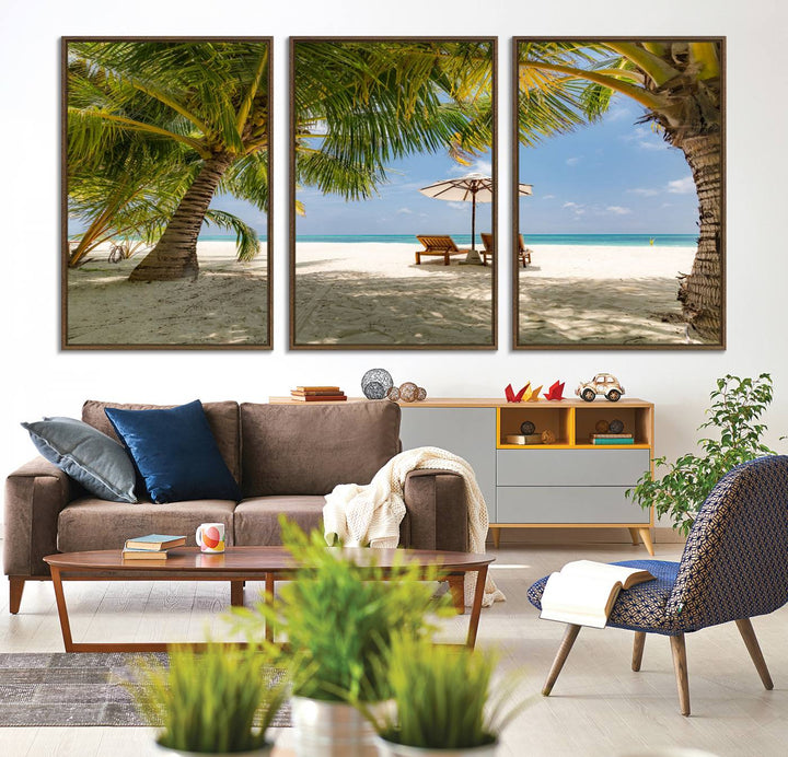 The canvas art print titled Lounge Chairs Palm Trees on Tropical Beach offers free shipping.