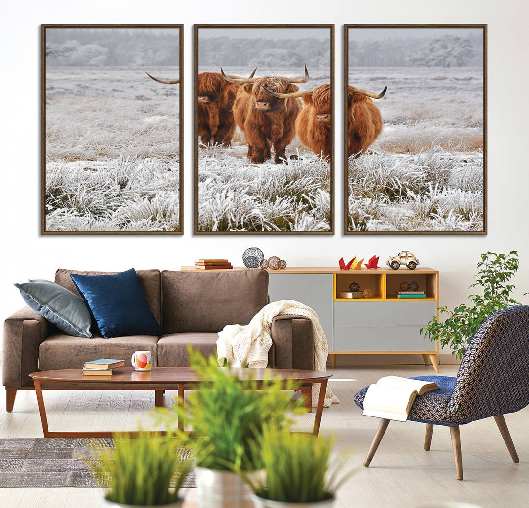 The Highland Cows in Snow canvas showcases three cattle in a frosty field.