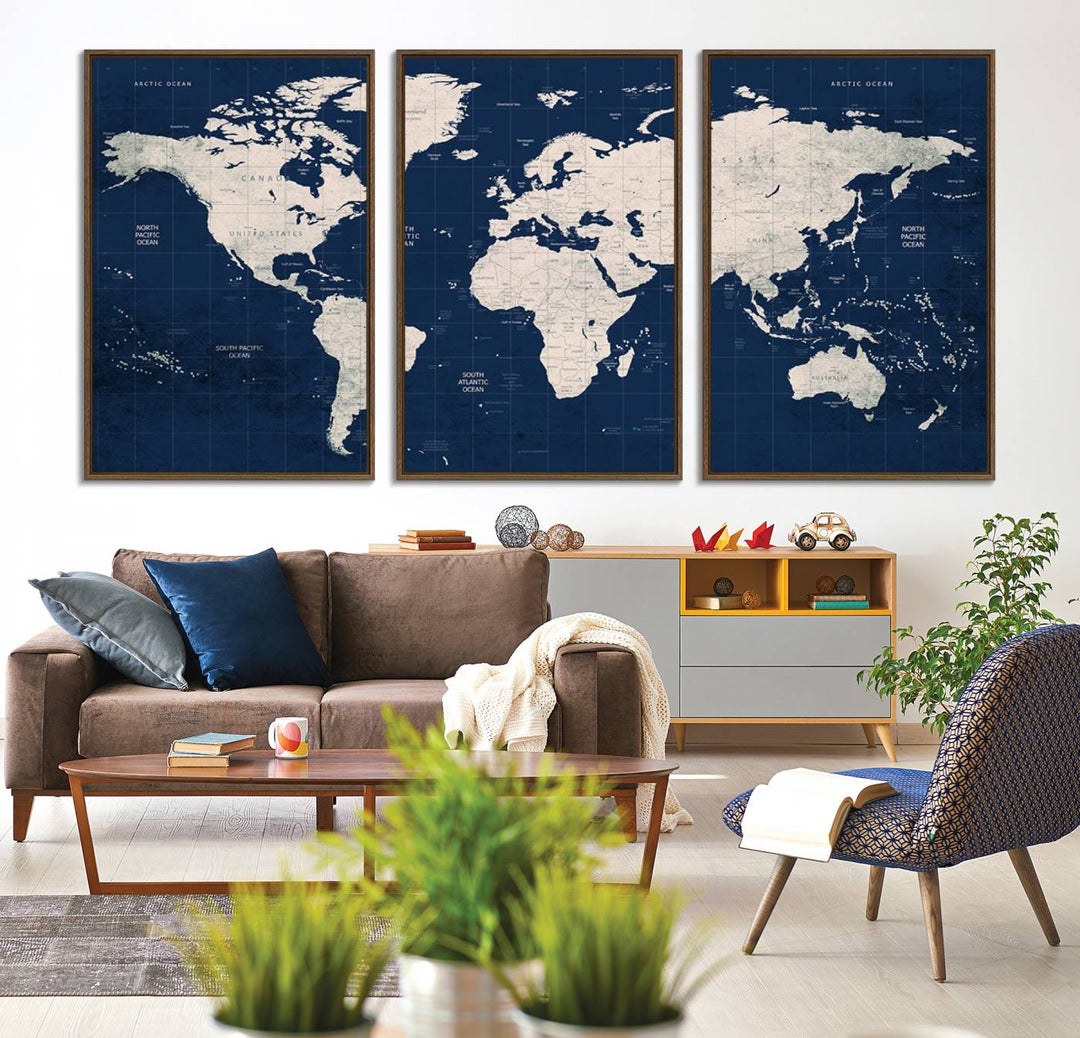 Large modern world map wall art canvas print in beige and navy; showcases a 3-panel vintage map design and is ready to hang.