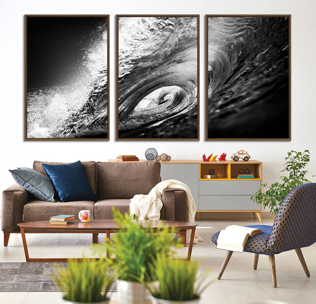 The Black Ocean Wave at Sunset Canvas Art hangs on a grey wooden wall.