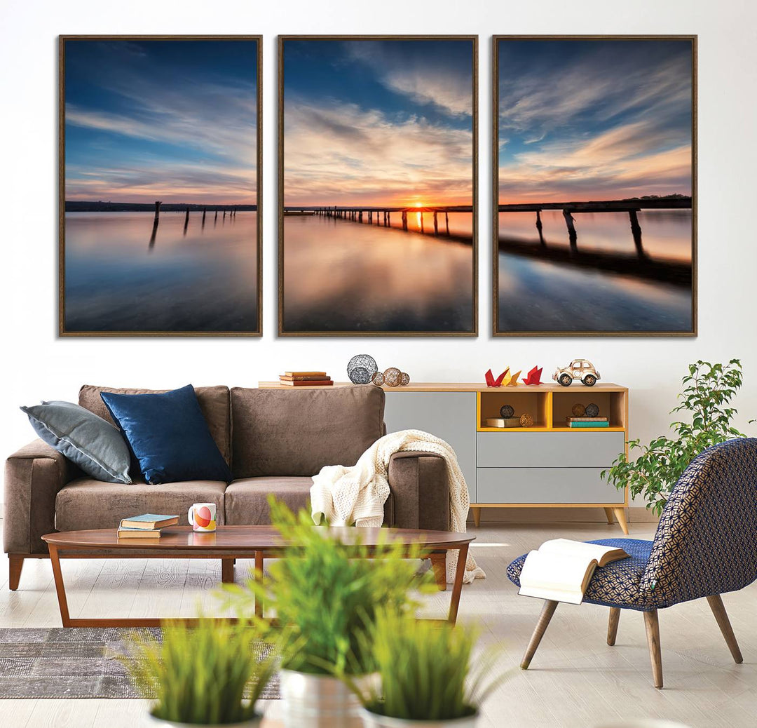 The Sunset Pier Canvas features a serene coastal landscape with vibrant hues under cloudy skies, ideal for modern decor.