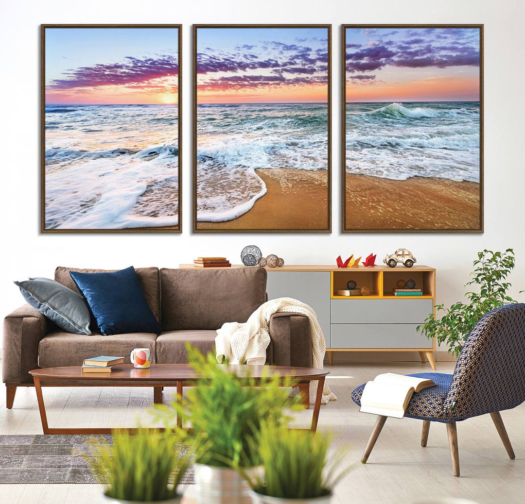 The Vivid Sunset Ocean Waves Triptych hangs on a wooden wall.