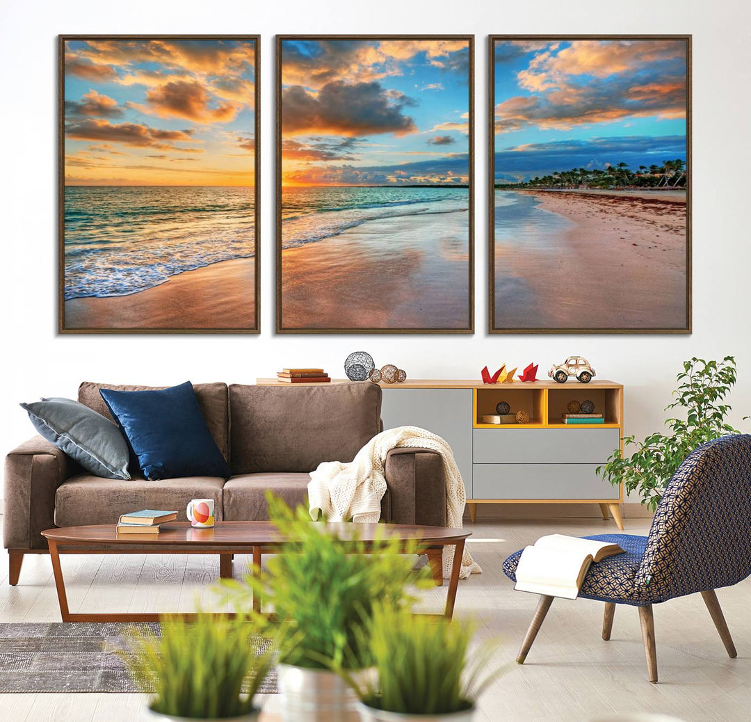 A wall displays Sunset Ocean Waves on Tropical Beach 3-panel canvas art.