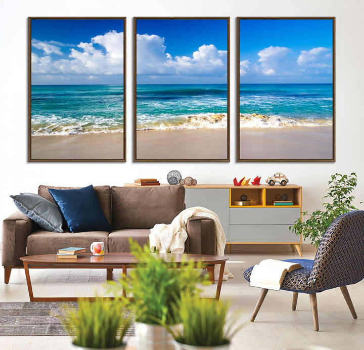 The Tropical Beach 3-Panel Canvas Wall Art features ocean waves gently lapping on a beach under blue skies, making it an ideal choice for coastal decor.