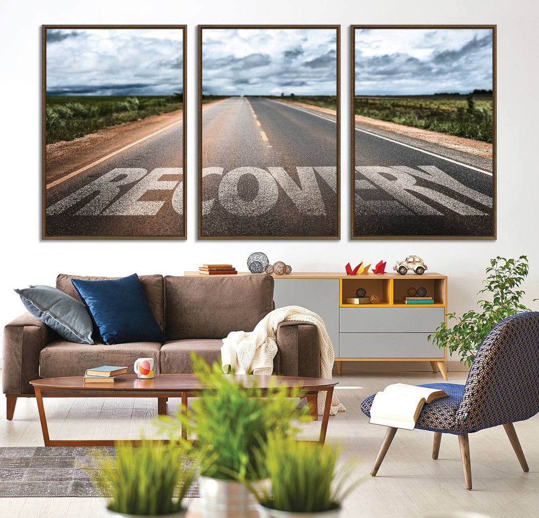 The Recovery Road Wall Art Canvas Print depicts a road under a cloudy horizon.