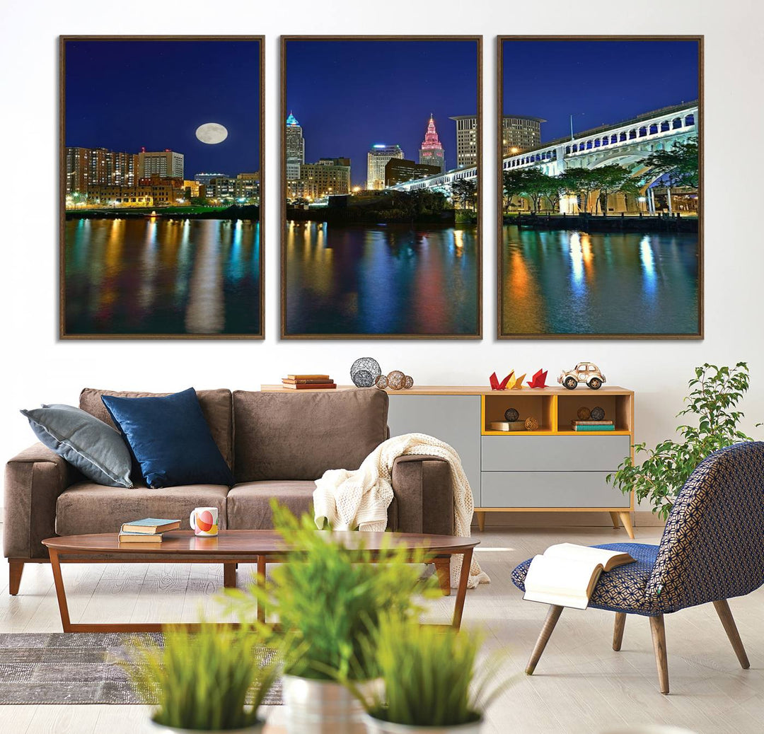 Cleveland City Lights Night Skyline Wall Art canvas showcases a moonlit cityscape reflected on water.