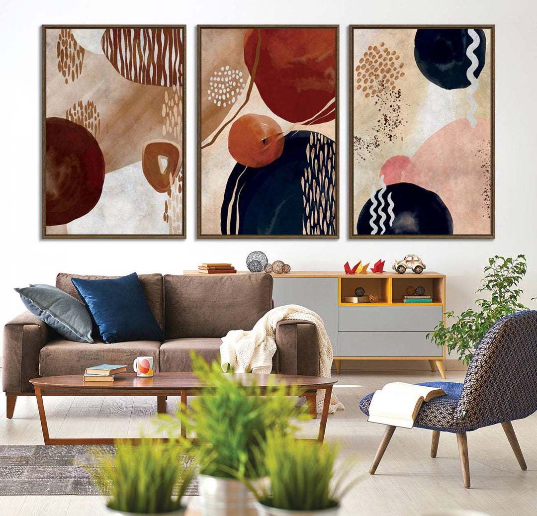 The Boho Neutral Canvas Print Set with earthy tones and circles hangs on the wall.