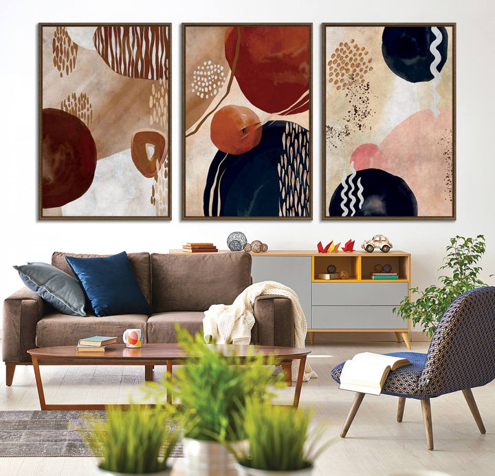 The Boho Neutral Canvas Print Set with earthy tones and circles hangs on the wall.