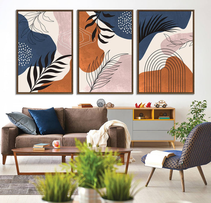 Boho Wall Art Canvas Print Set showcases mid-century geometric and leaf motifs in blue, ochre, and pink.