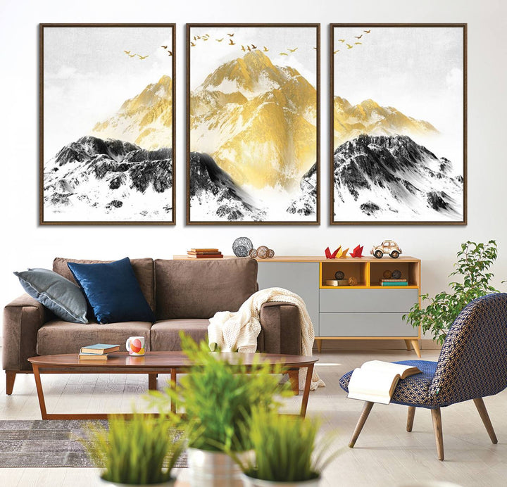 Golden Mountain Triptych Wall Art features gold-tinted mountains and birds.