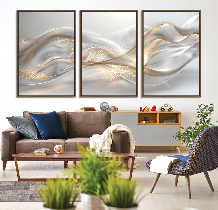 A modern living room is enhanced by the Abstract Art Grey and Gold Lines Wall Art, its elegant lines shimmering against a dark wall.