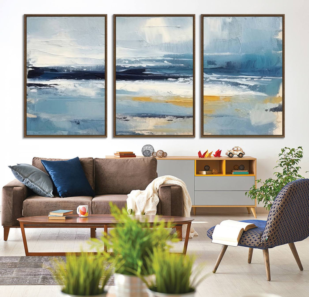 The Abstract Ocean Canvas Wall Art in coastal blue and gold enhances the modern kitchen.