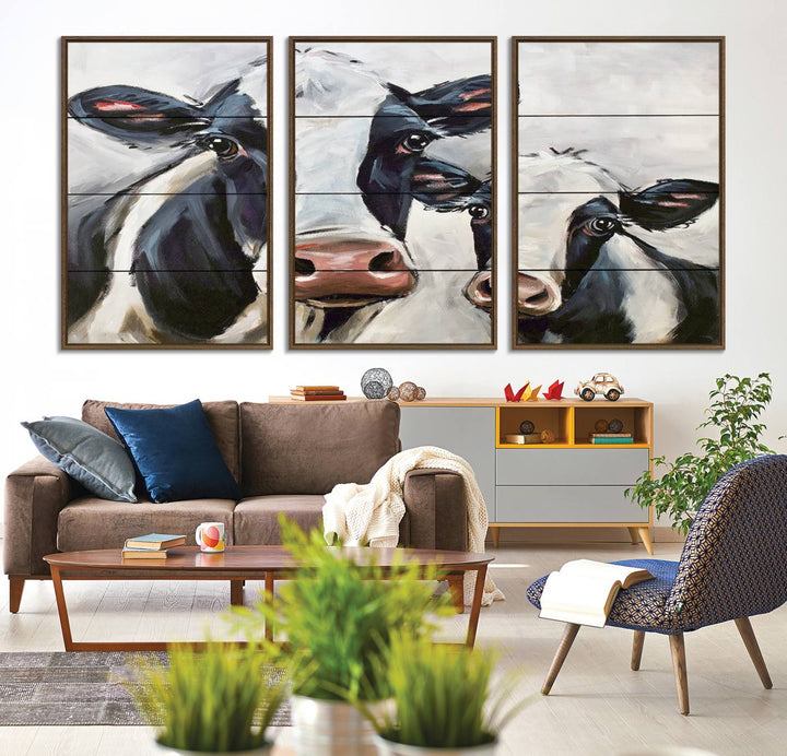 The Vintage Baby and Mom Cattle Canvas, featuring cows with black and white patches, is a prominent piece of wall art.