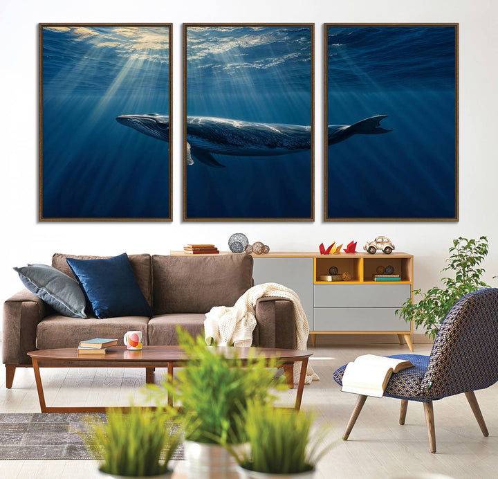 The Whale under Ocean wall art canvas print graces the white wall.