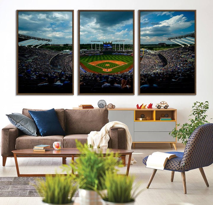 A 3-panel print of Kauffman Stadium, showcasing a crowded baseball field under cloudy skies.